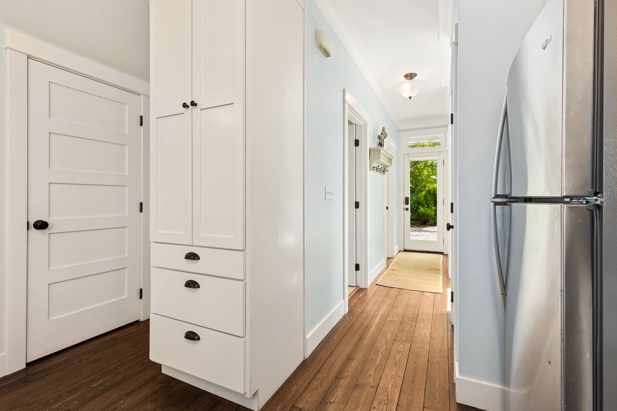 Main level hallway leading to kitchen