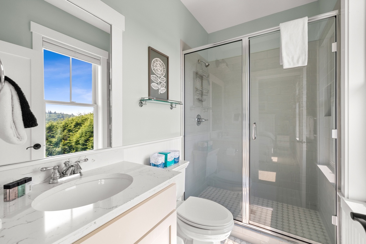 Primary ensuite bathroom offers walk-in shower and plenty of counter space