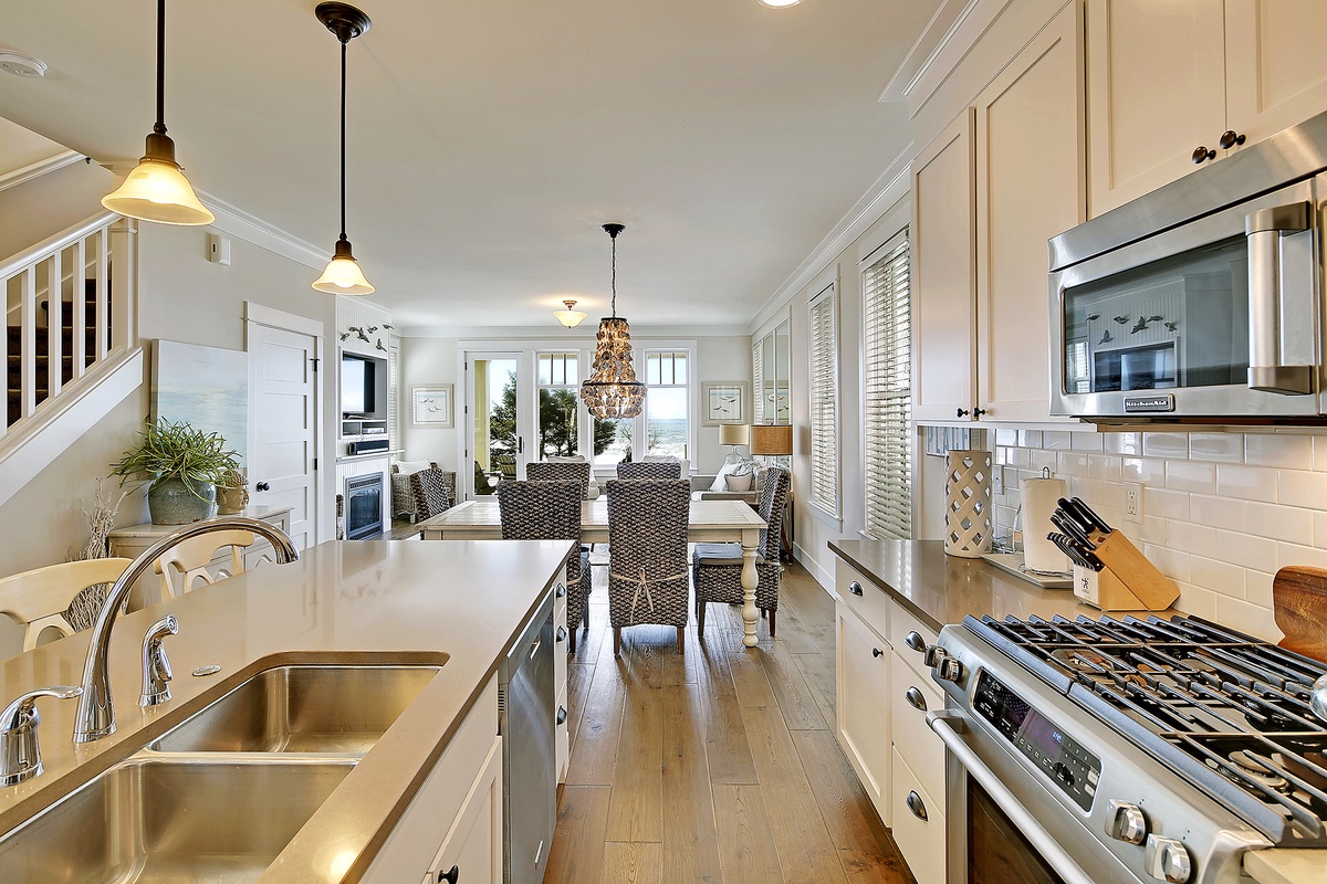 Beautiful kitchen with gas range and stainless steel appliances