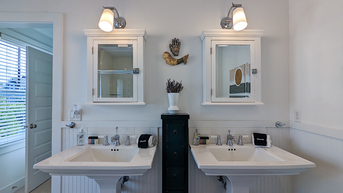 Primary ensuite bathroom with double vanities
