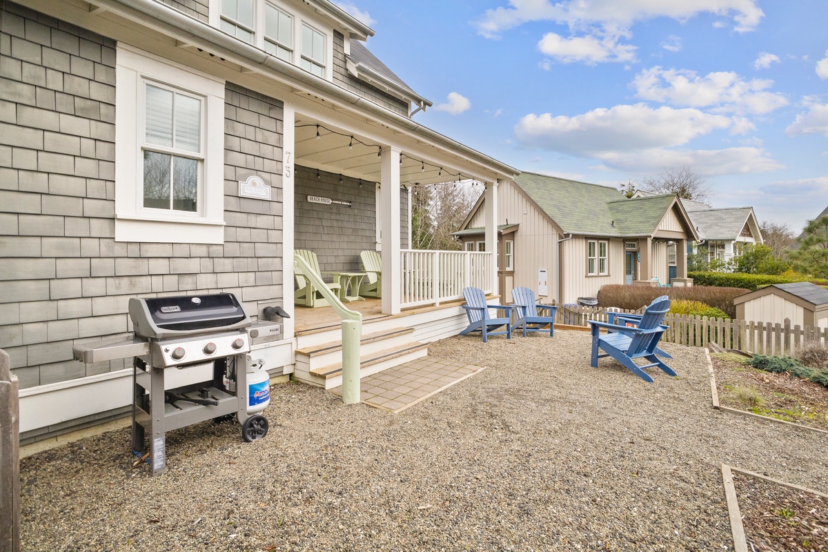 Front entry with BBQ and Adirondack chairs