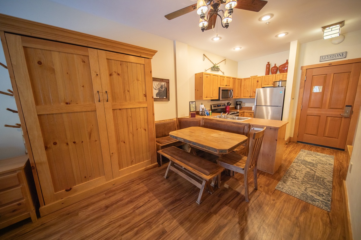 Folded Murphy bed and dining area