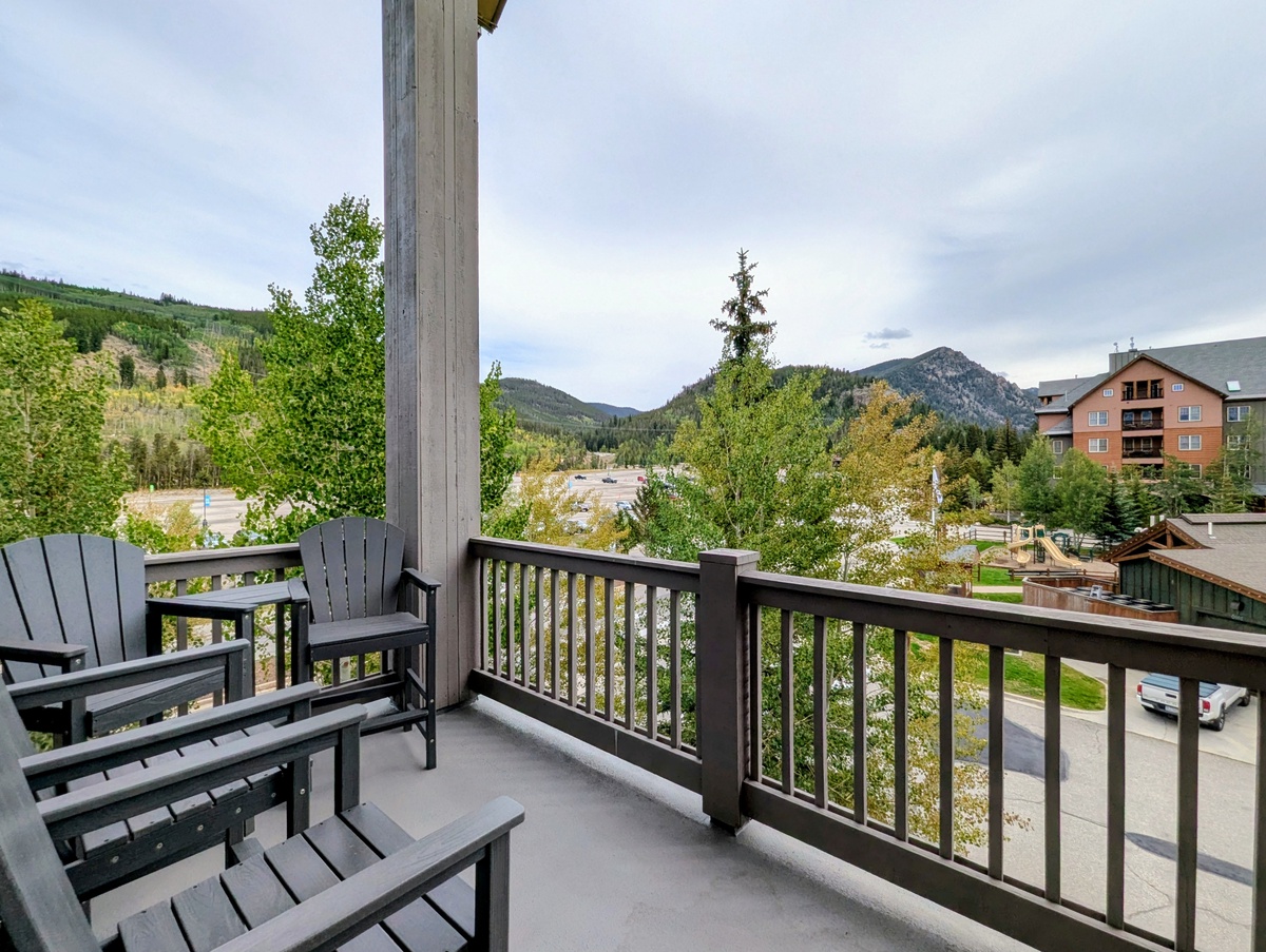 Settle into your private balcony with stunning mountain vistas stretching beyond the trees—perfect for morning coffee or unwinding after exploring the surrounding area.