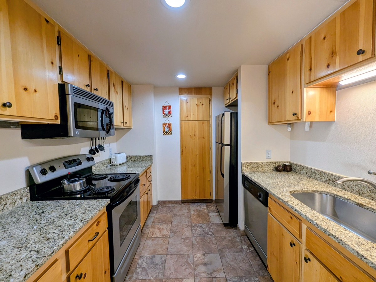 Full kitchen with stainless appliances and plenty of counter space