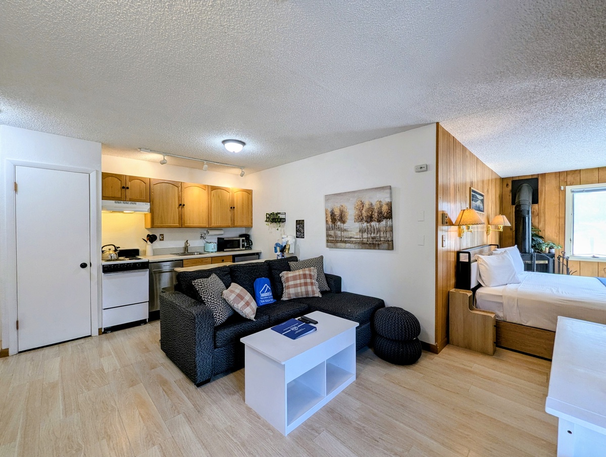 Your cozy studio offers all you need: a comfortable sleeping area, a full kitchenette for easy meal prep, and a welcoming living space with a plush couch perfect for unwinding after a day of adventure.