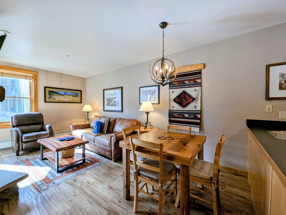 Relax in this warmly appointed space where rustic charm meets modern comfort, featuring cozy seating and a dining area for memorable meals together.