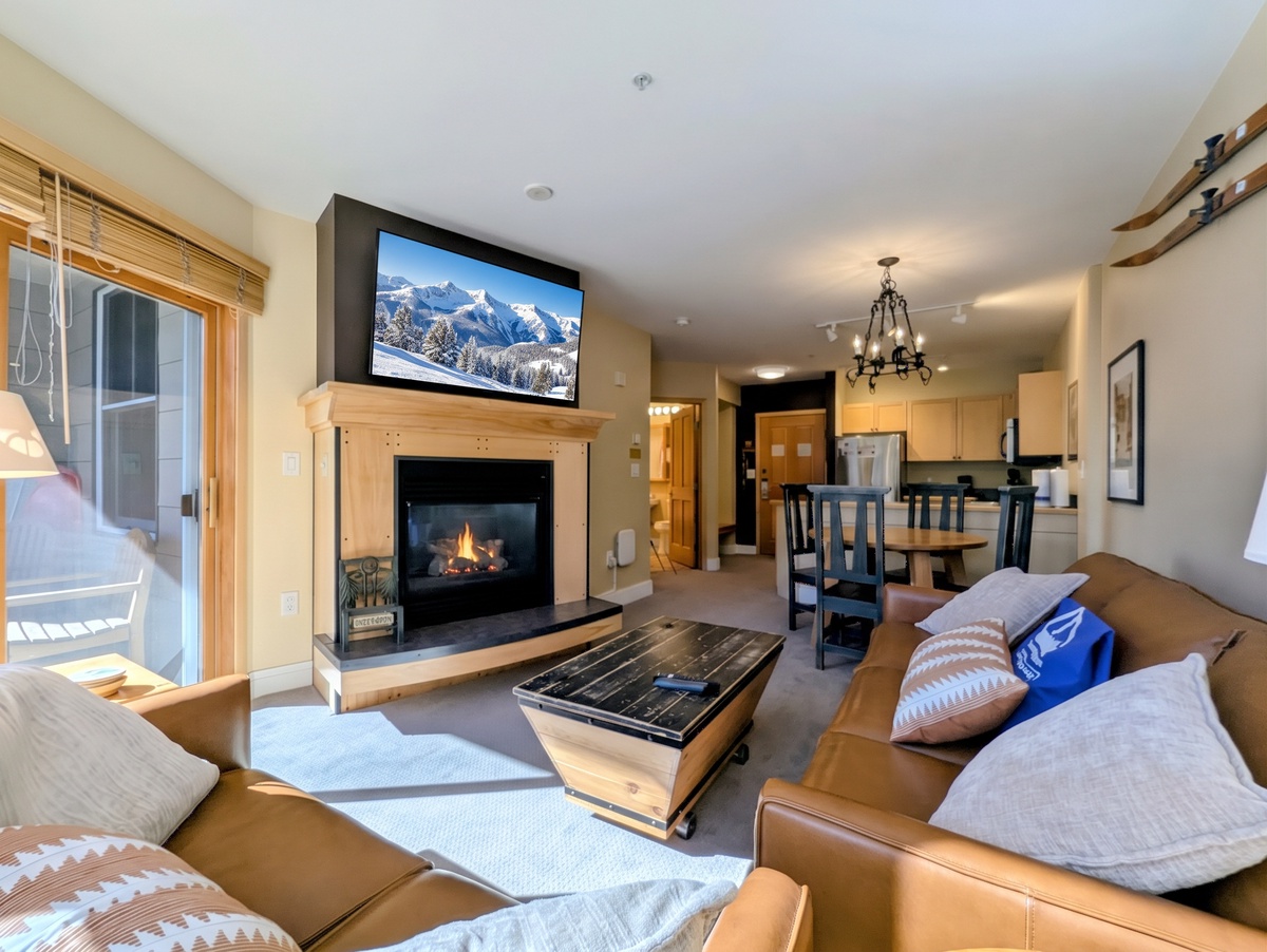 Cozy living room with leather sofas and gas fireplace