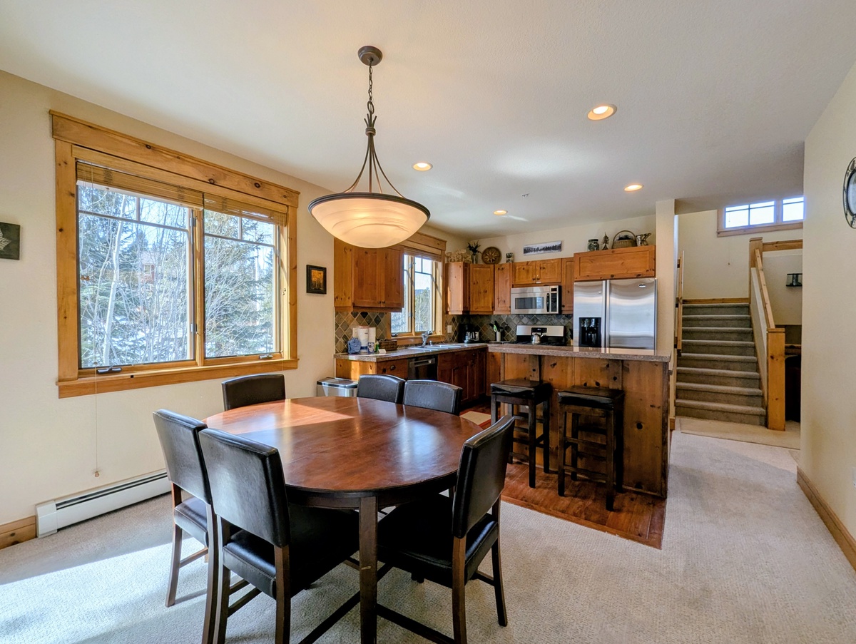 Gather around your spacious dining table while savoring mountain views through the large windows, then whip up meals in your fully-equipped kitchen.
