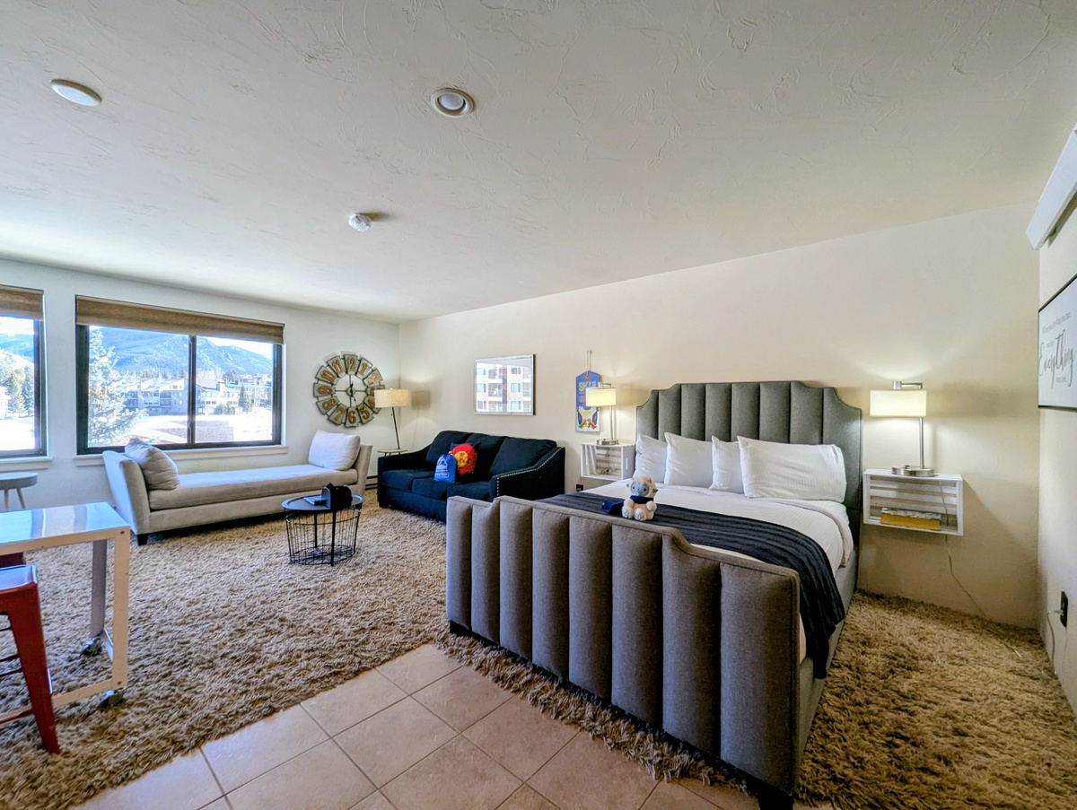 Unwind in your sophisticated suite where comfort meets style, featuring mountain views and elegant furnishings for the perfect getaway.