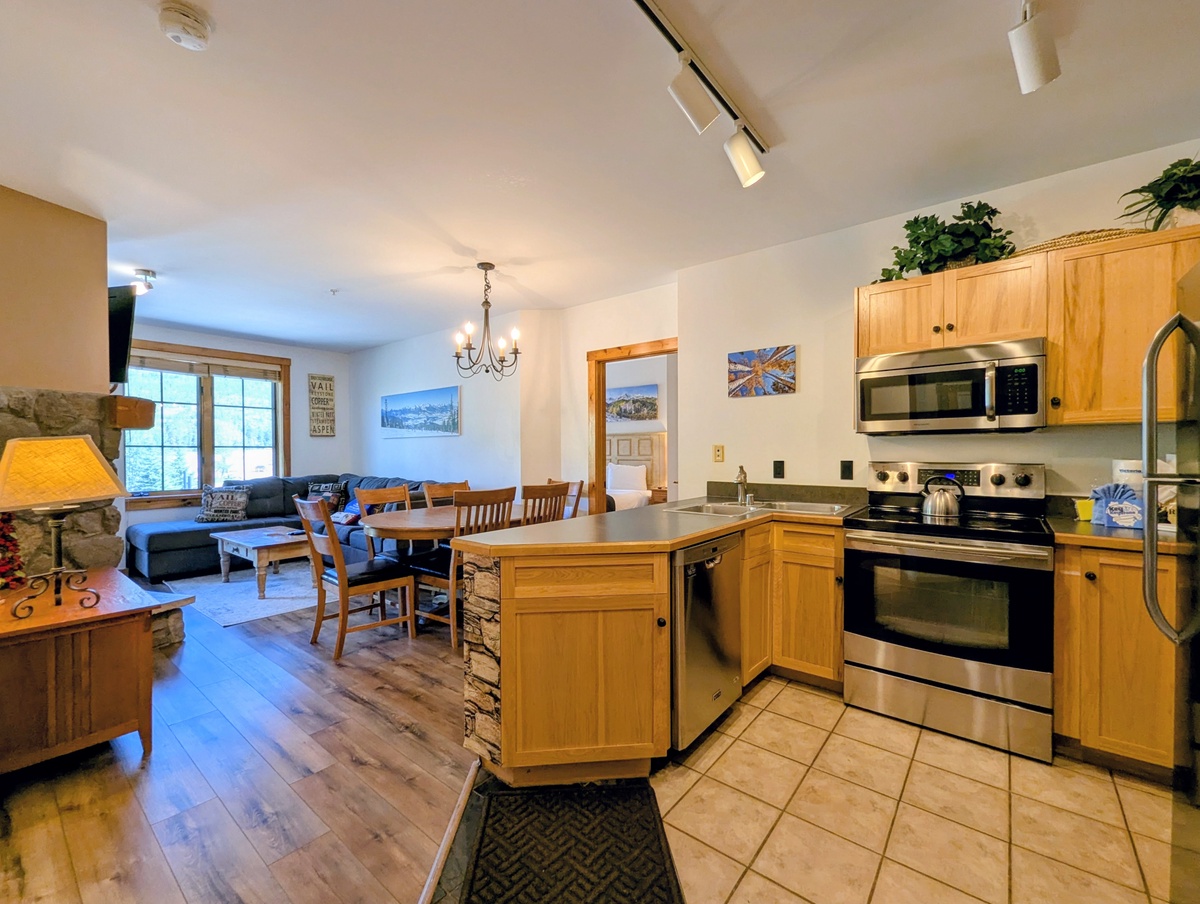 Spread out in this bright open-concept space where your kitchen, dining, and living areas flow seamlessly together—perfect for gathering, cooking, and relaxing all in one inviting space.