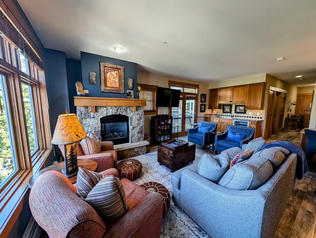 Living room with a fireplace and television