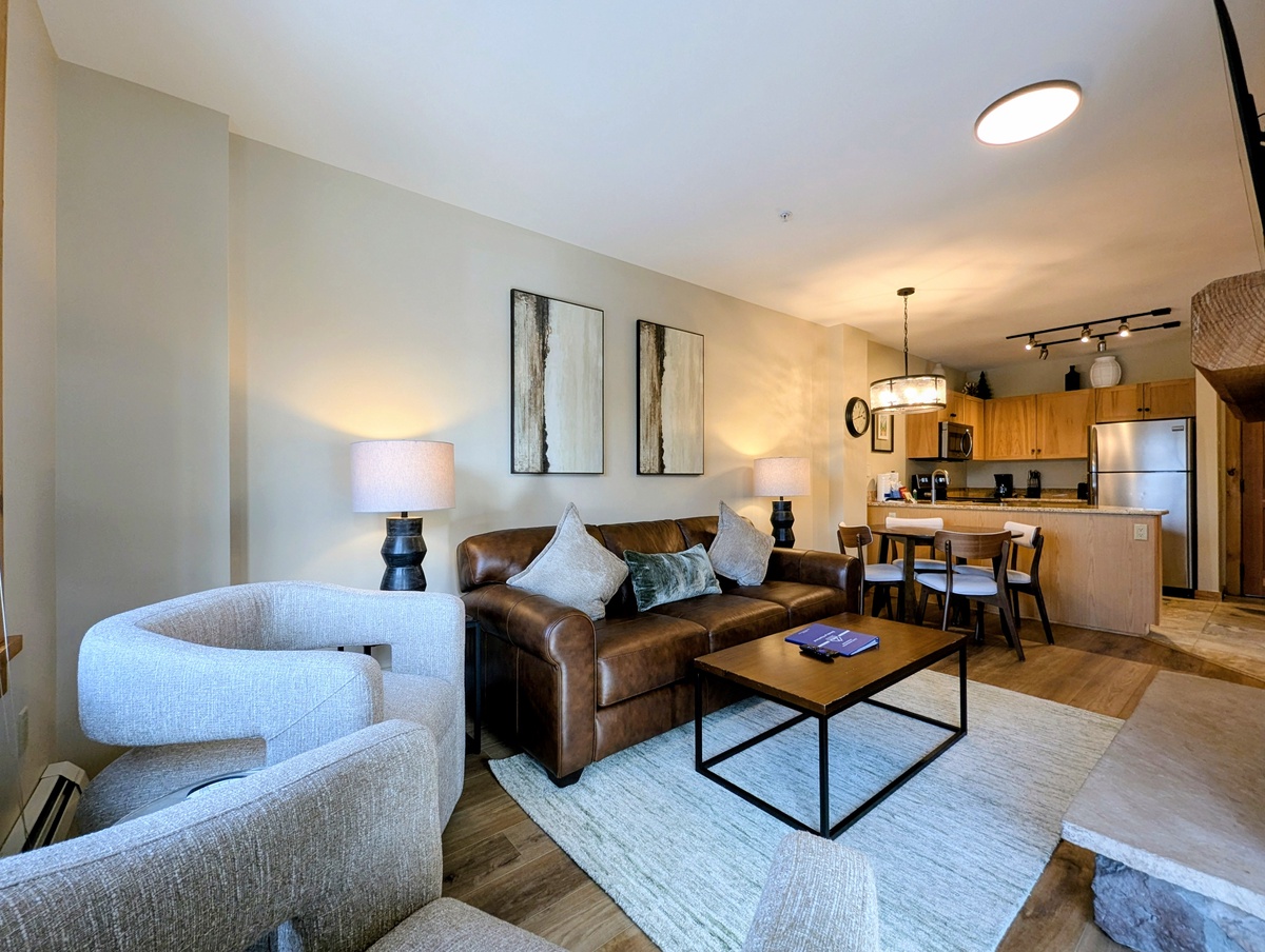 Sink into the soft leather sofa and enjoy your open-concept living space with modern kitchen and thoughtful touches throughout.