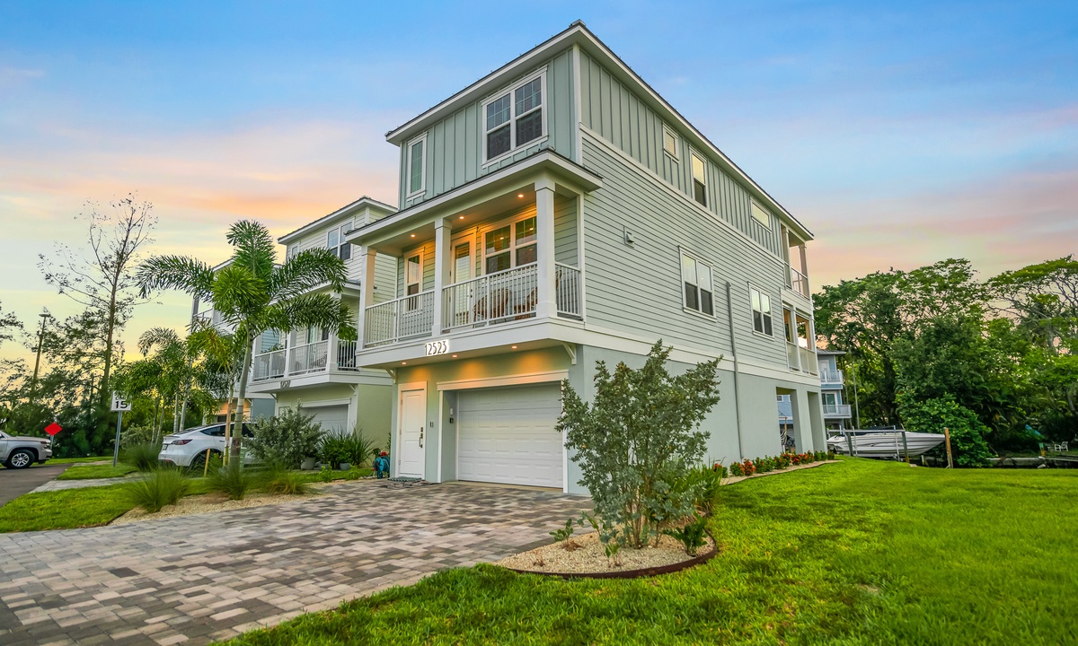 a house with a garage and a lawn
in Hunters Point community in Cortez Florida