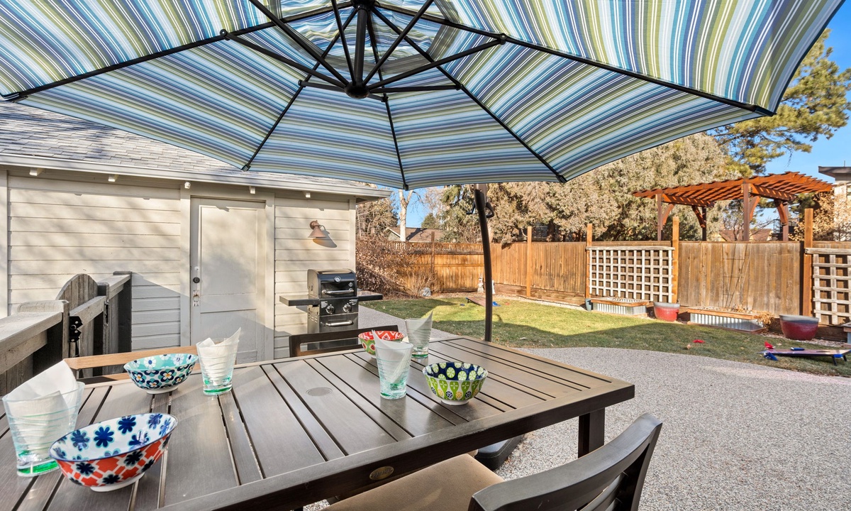 Private Patio with Outdoor Dining Area and Large Umbrella