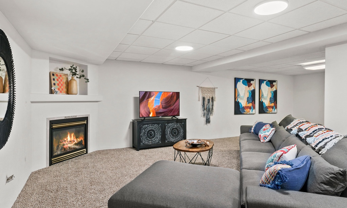 Basement | Lounge Area with Fireplace and Smart TV
