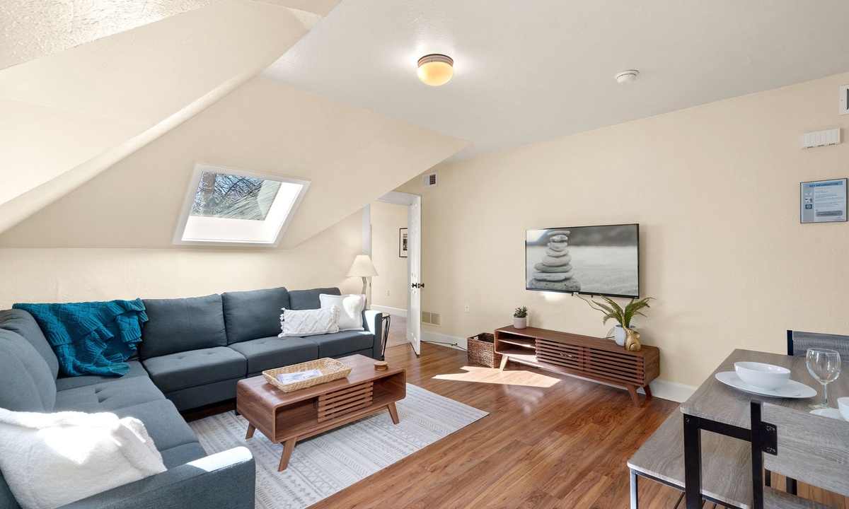 Living Room with Skylights and Smart TV