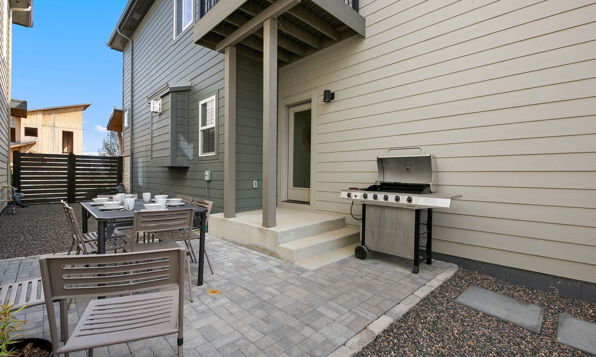 Outdoor Area | Xeriscaped Side Yard with Outdoor Dining Table and BBQ Grill
