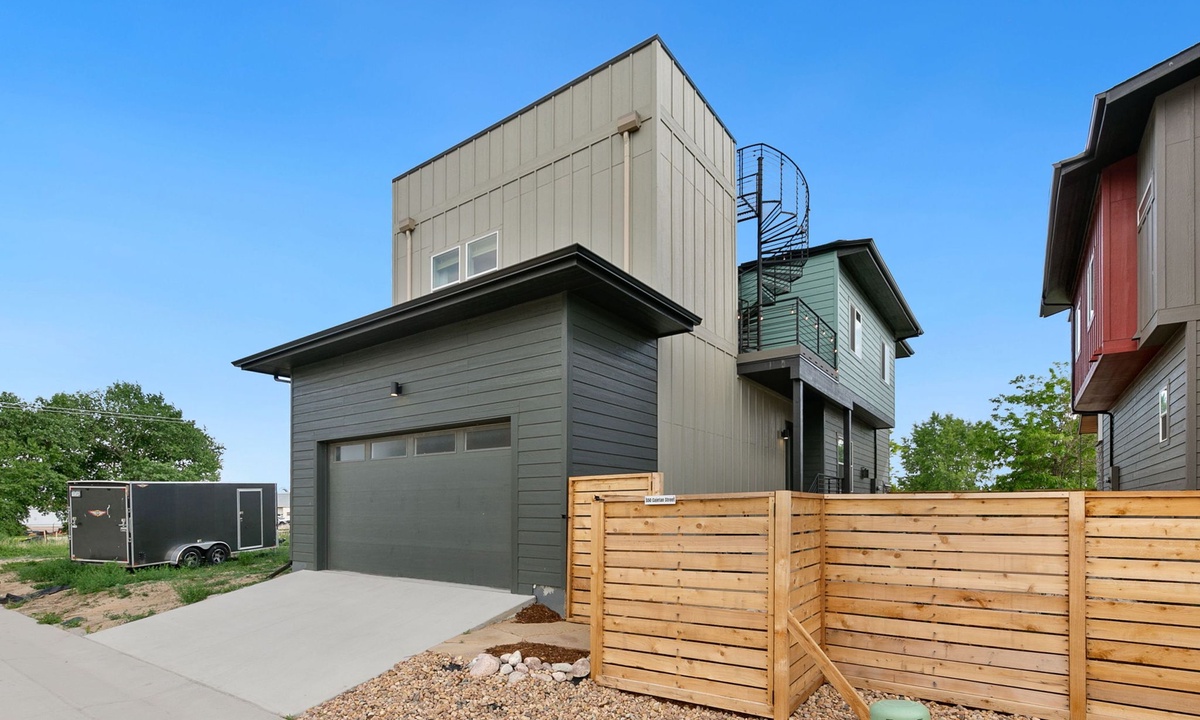 Back Exterior | Spiral Staircase to Rooftop Deck and Garage Parking