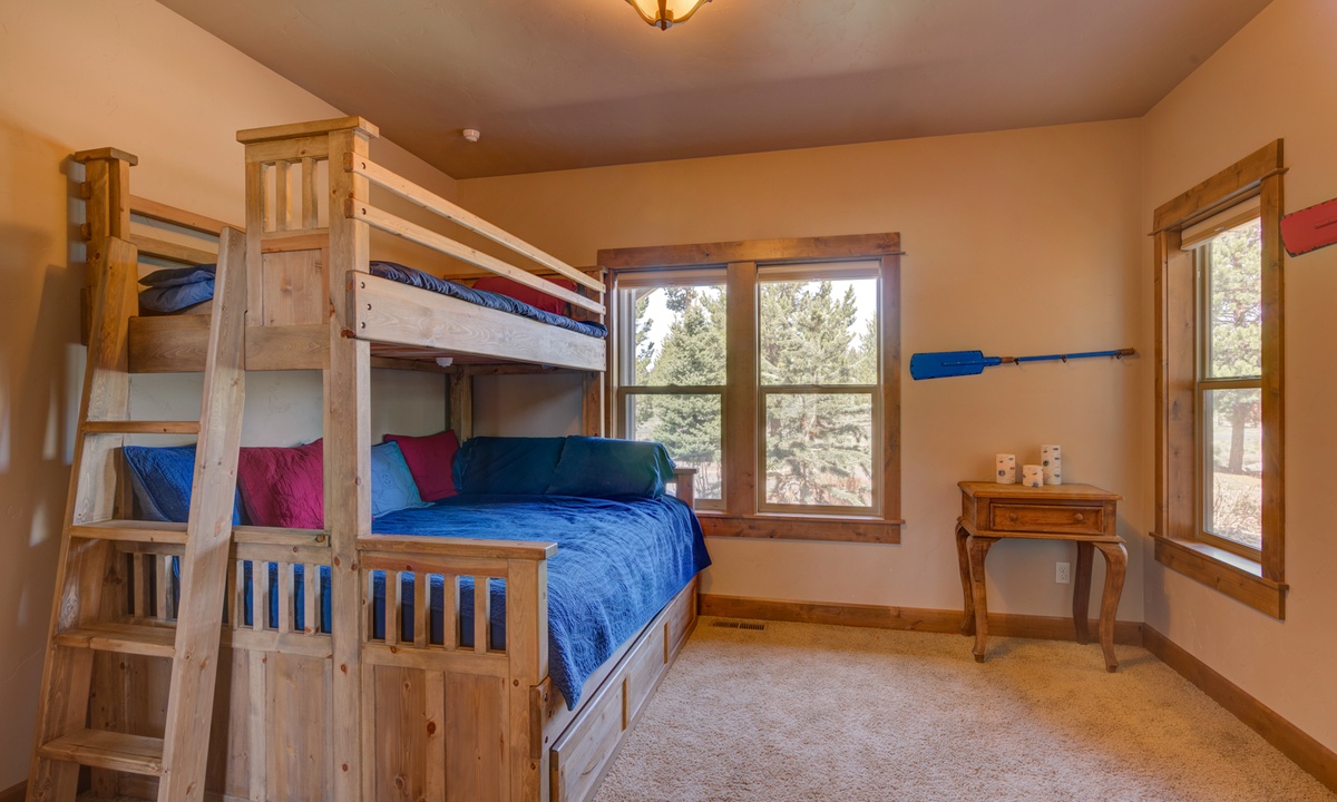 Guest bedroom with pyramid bunk beds and trundle.