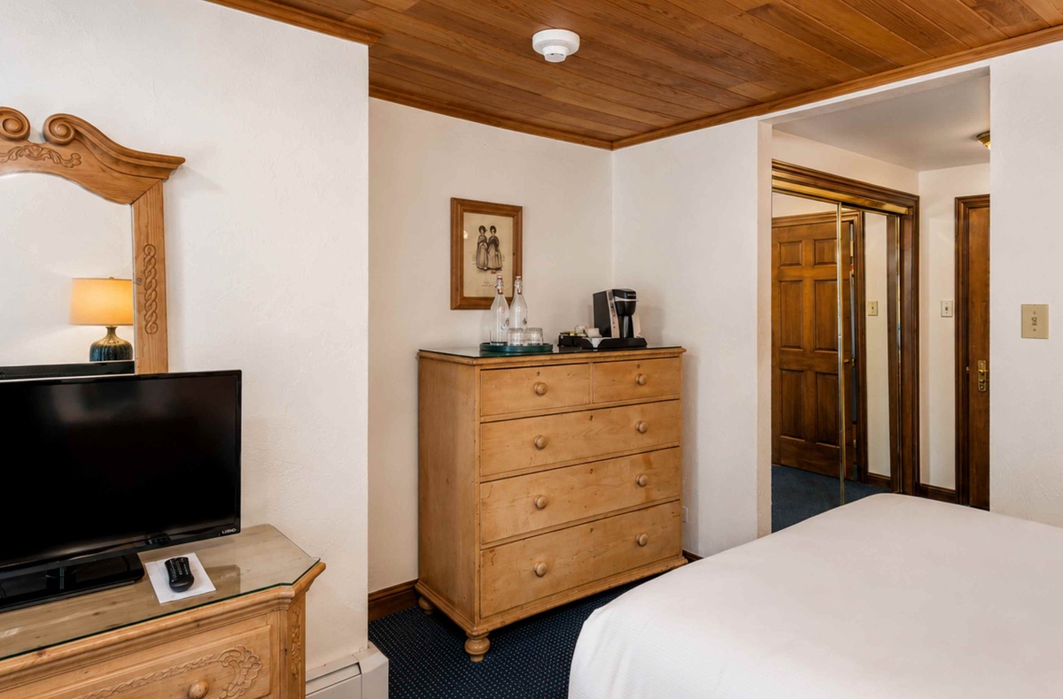 Settle into your cozy retreat with warm wood accents, a flat-screen TV for unwinding, and a coffee maker to start your mornings just right.