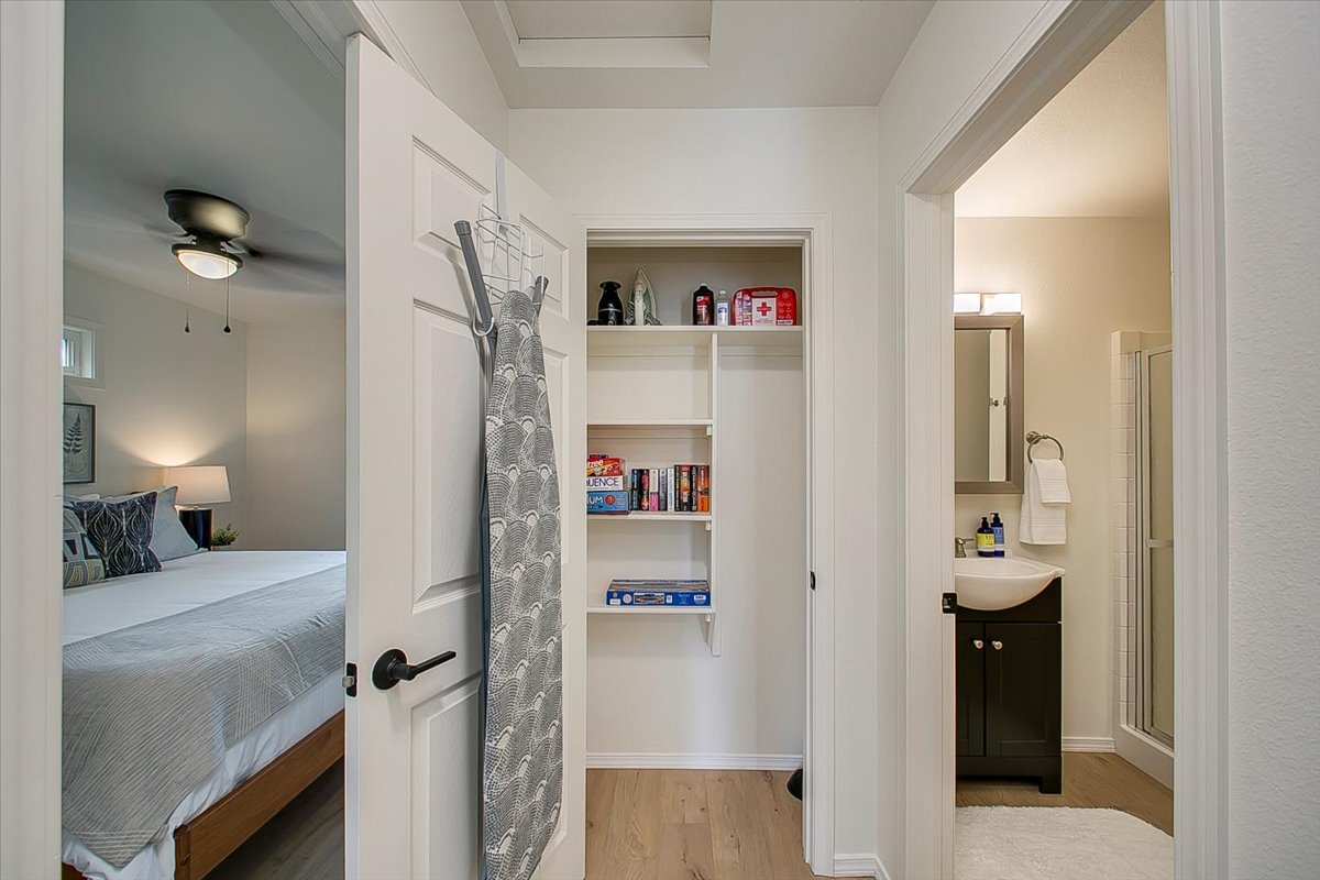 Your spacious hallway connects the cozy bedroom to your private bathroom, with convenient built-in storage for all your vacation essentials.