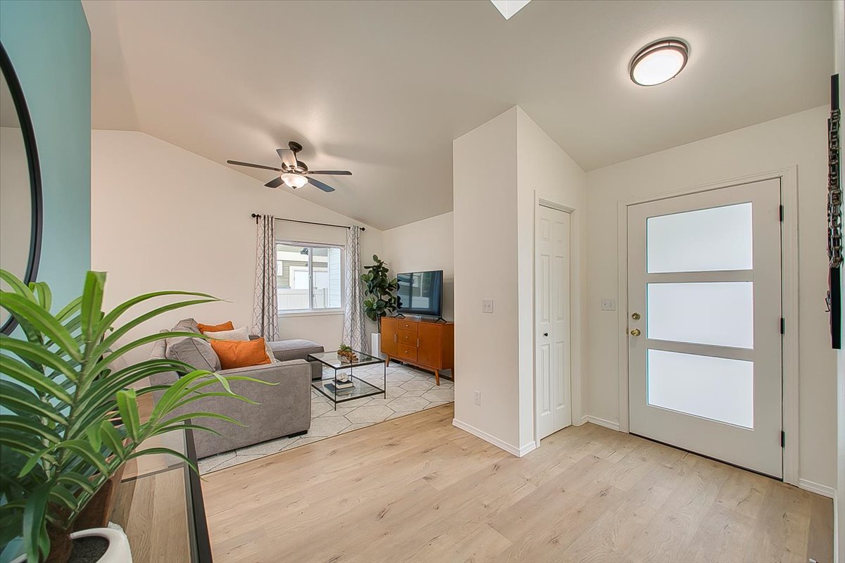 Step into your bright, modern sanctuary with soaring ceilings and stylish furnishings that invite you to unwind in comfort.