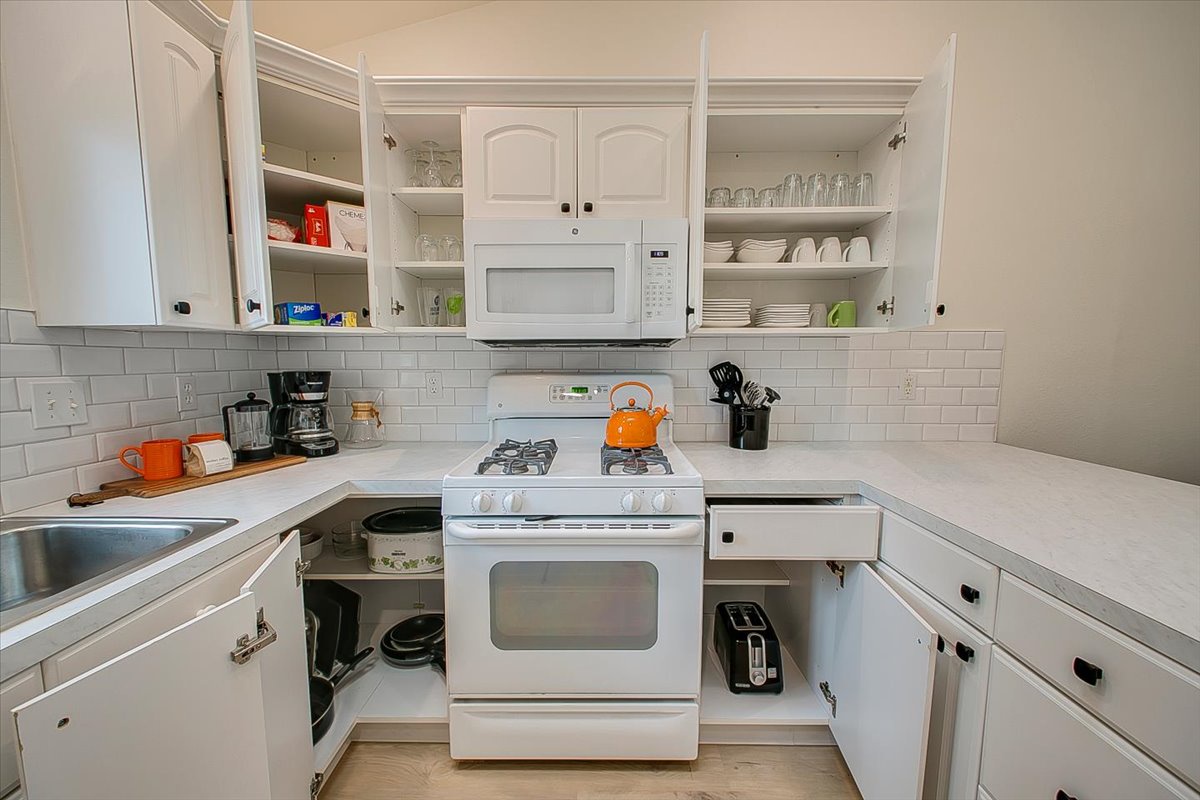 Your fully-equipped kitchen awaits with everything needed to create memorable meals, from morning coffee to family dinners.