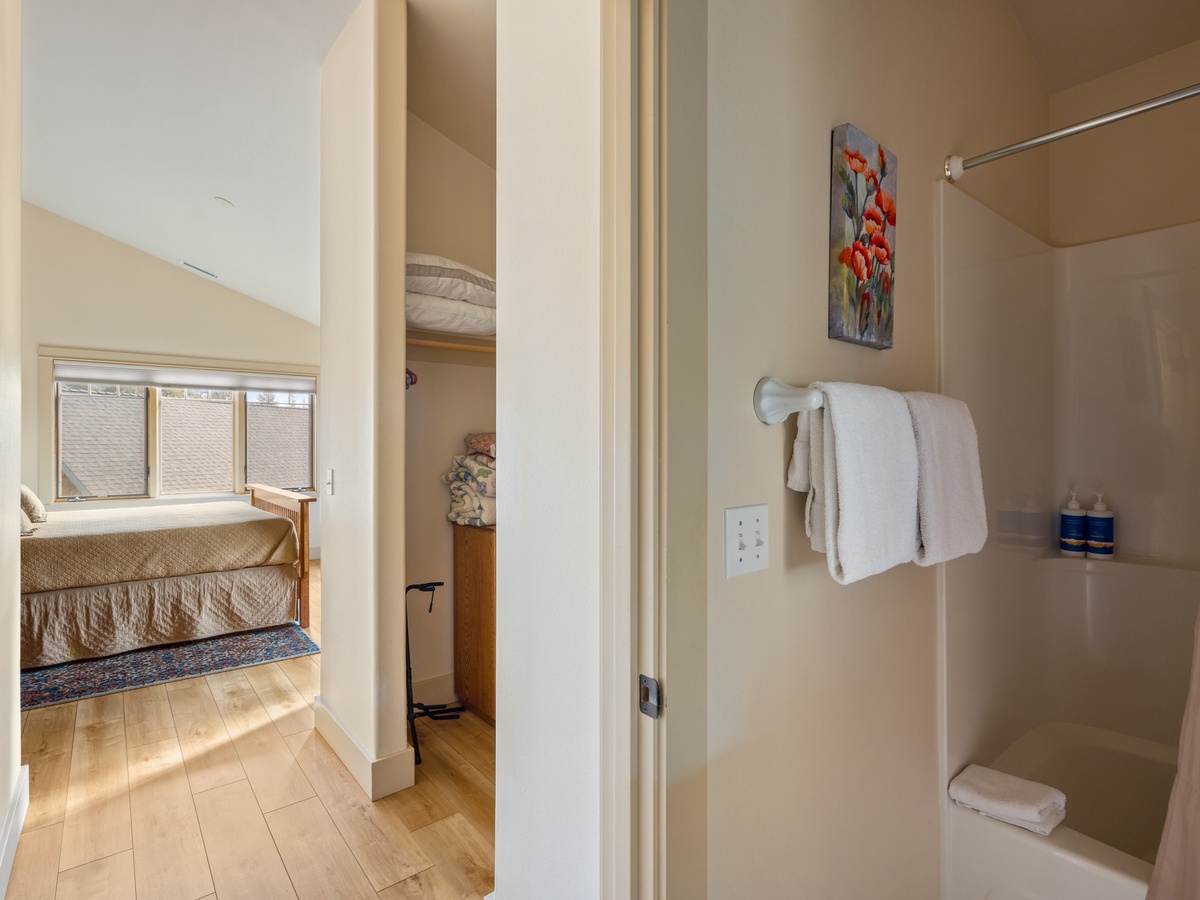 Fresh towels await in your private bathroom, with the cozy bedroom just steps away for ultimate convenience.
