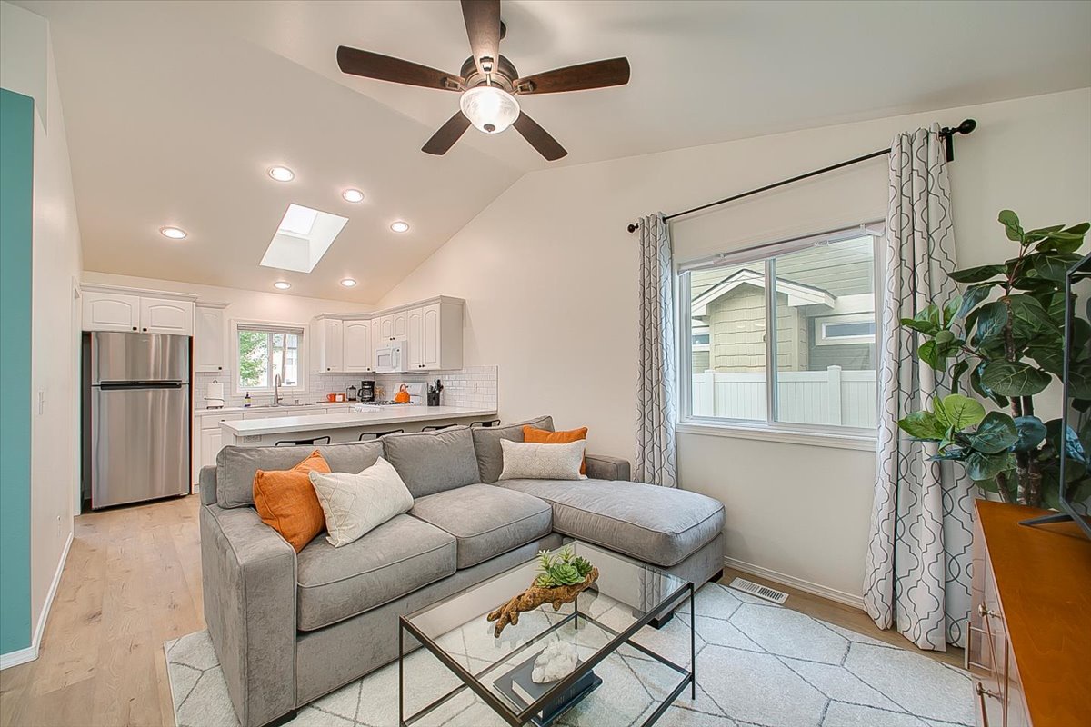 Relax in your bright living space with plush sectional seating and modern kitchen just steps away.