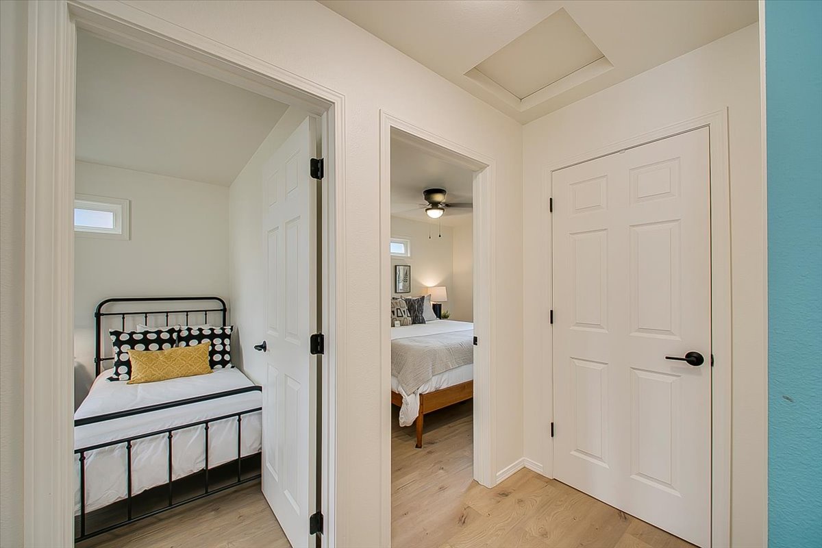 Your hallway leads to charming bedrooms with thoughtful design touches and cozy sleeping spaces for everyone in your group.