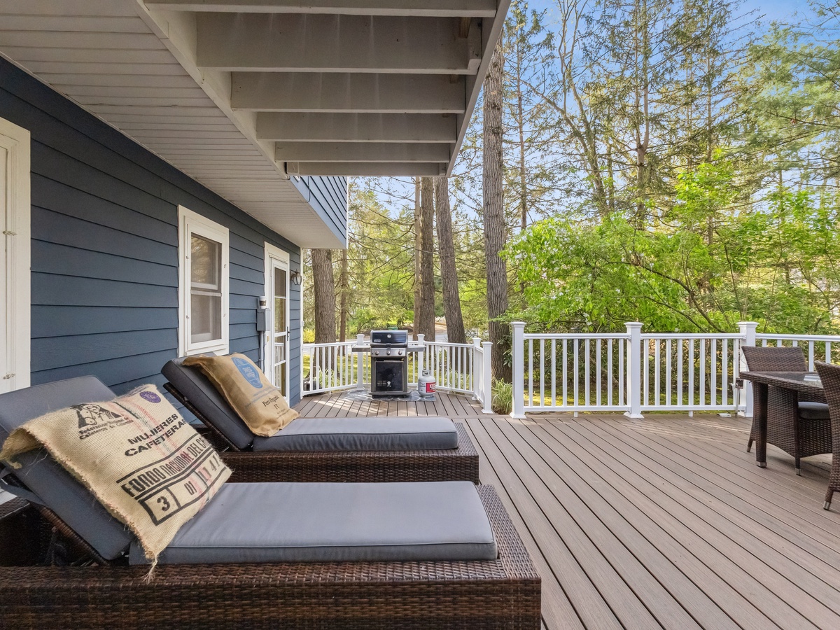 Relax in the chaise lounge chairs on the back deck, a perfect retreat for rest and relaxation.