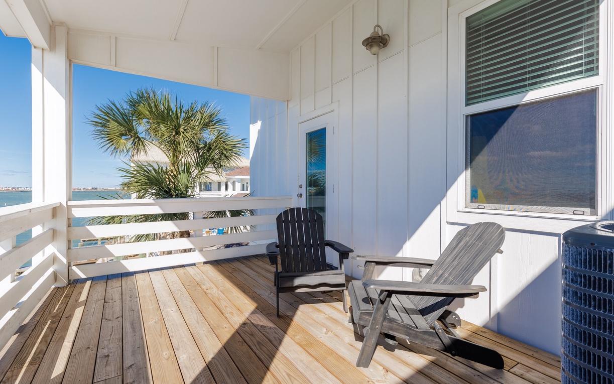 Step onto your private waterfront balcony where tropical breezes and stunning views await your morning coffee or sunset relaxation.