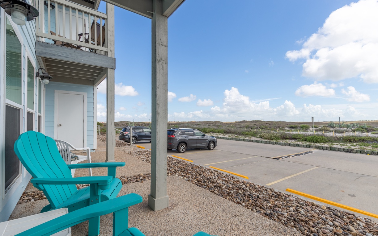 Charming coastal property with convenient parking and natural landscape views stretching to the horizon.