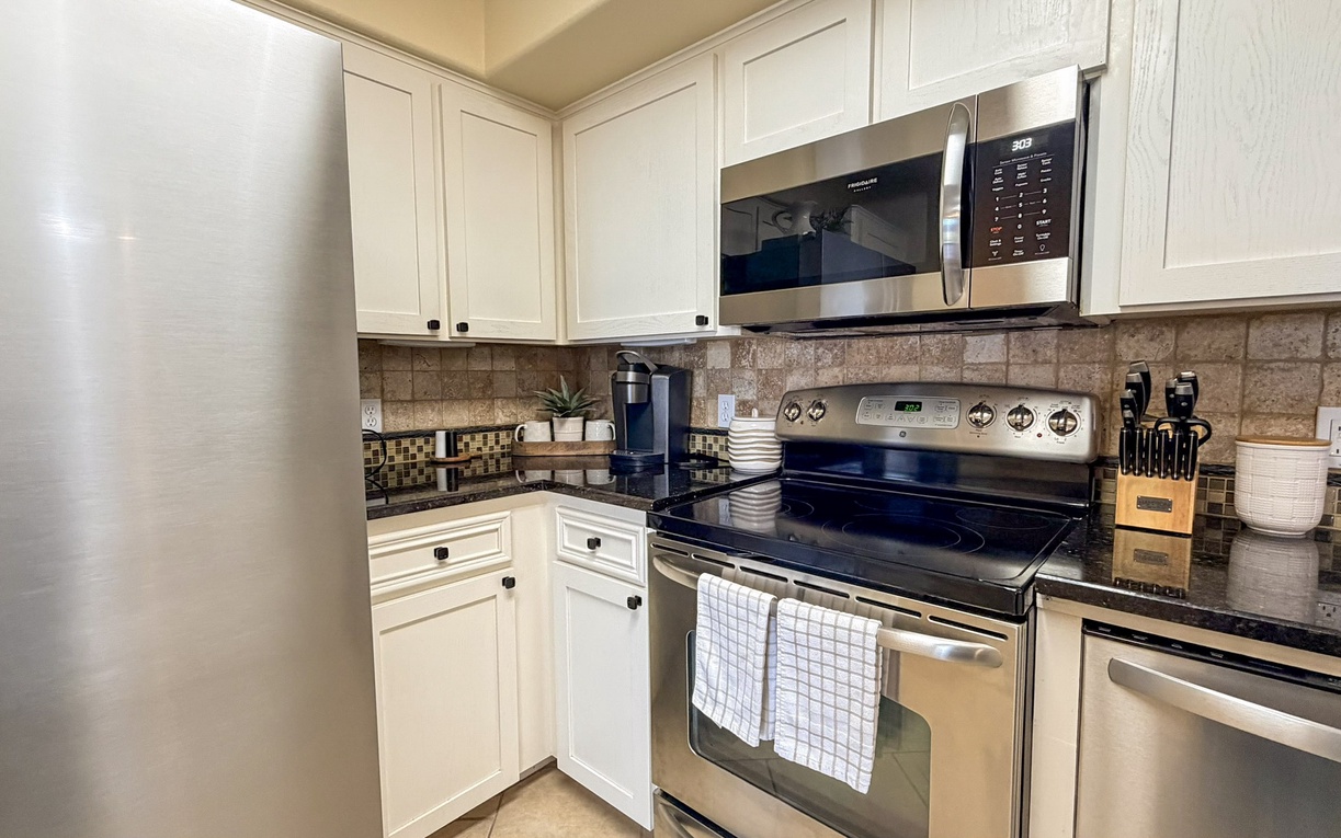 Your fully equipped kitchen awaits with stainless steel appliances, granite counters, and everything you need to create memorable meals during your stay.