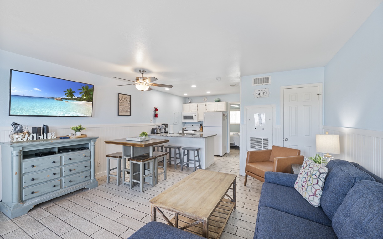 Your bright, open-concept retreat features coastal charm with comfortable seating, full kitchen, and beach vibes throughout.