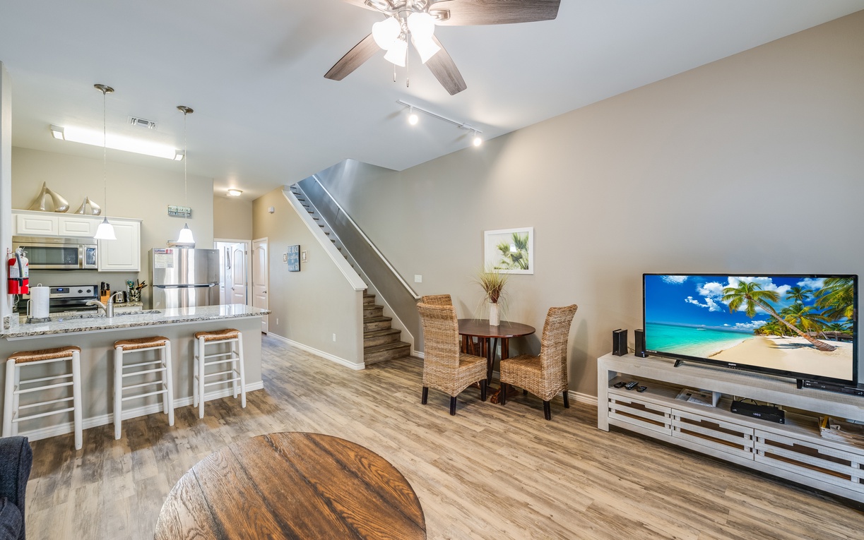 Your spacious open-concept haven combines modern coastal style with cozy comfort, featuring a fully-equipped kitchen flowing into inviting living spaces.