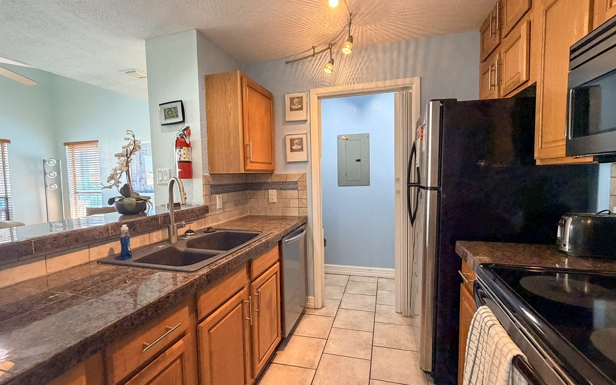 Your fully equipped kitchen awaits with granite counters, stainless appliances, and everything you need to create memorable meals during your stay.