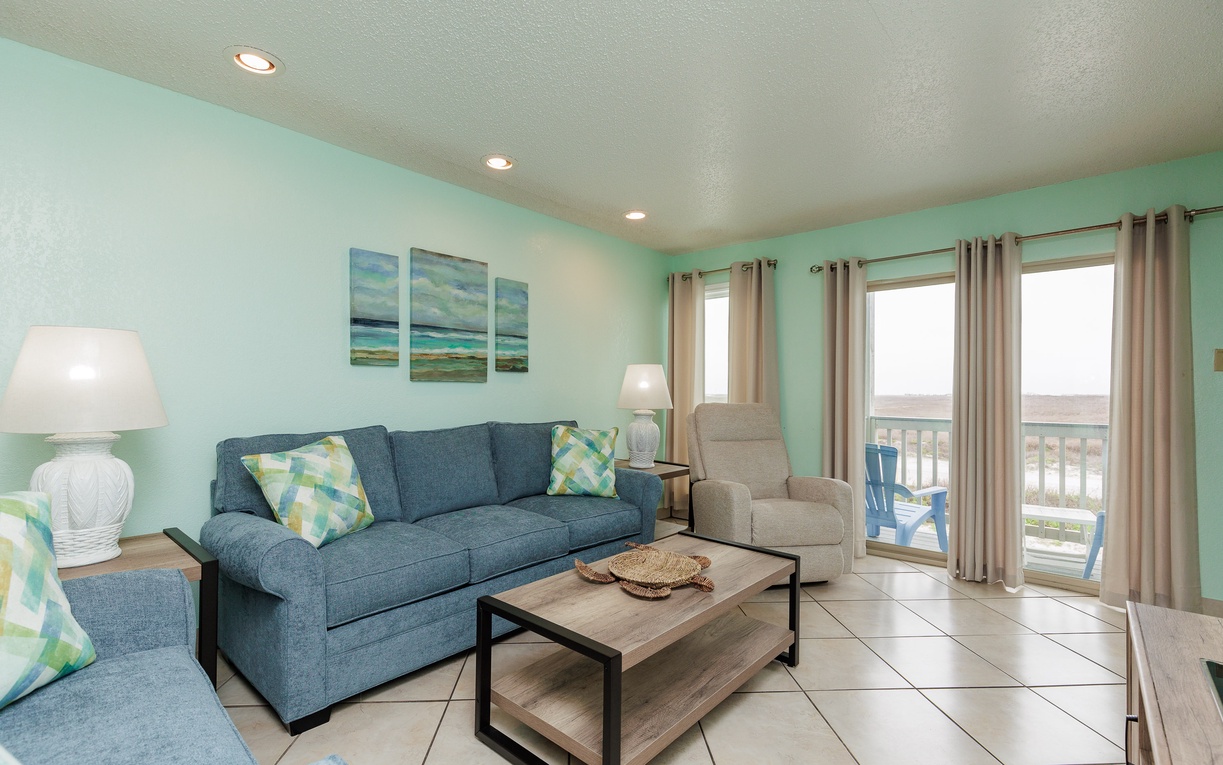 Sink into this coastal-inspired living room where soft blues and comfortable seating invite you to unwind after beach days.