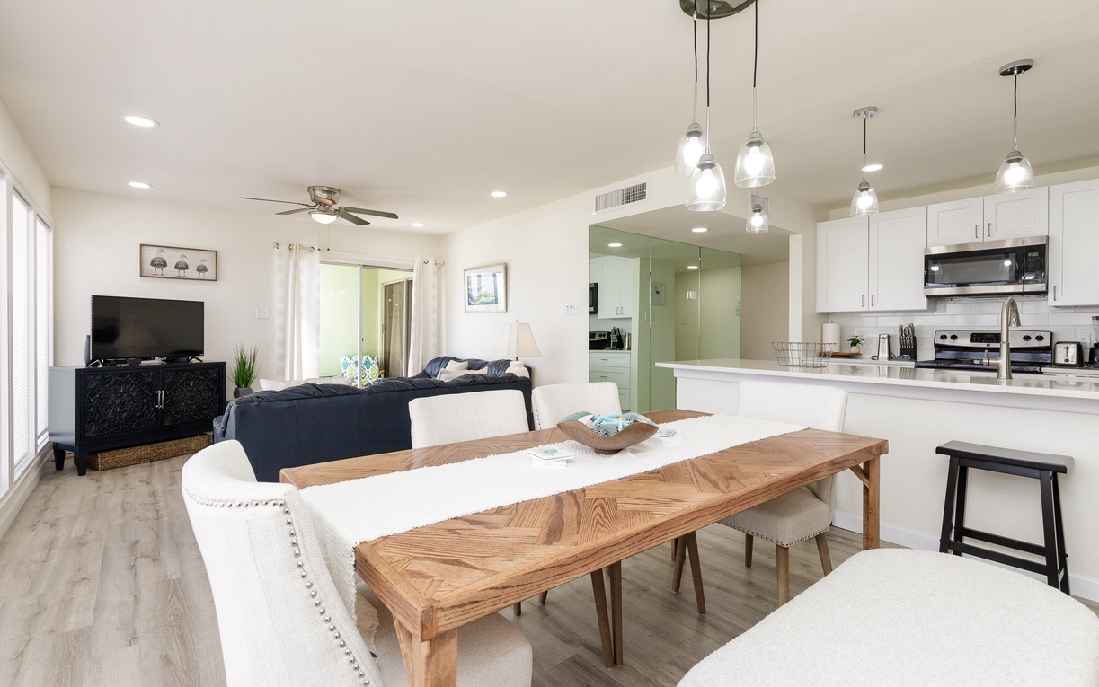 Relax in your bright open living space with modern kitchen, cozy seating, and stylish dining for memorable meals together.
