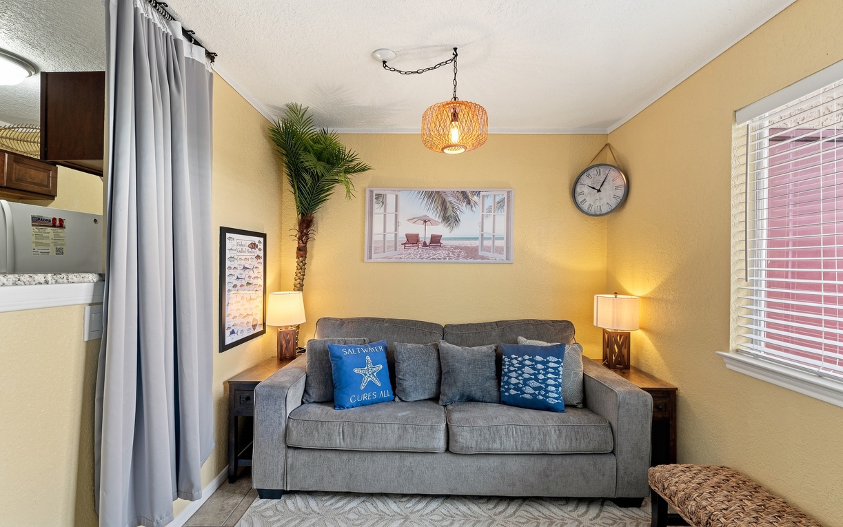 Settle in and unwind on this cozy sofa bathed in warm, sunny light—your personal retreat for relaxing evenings.