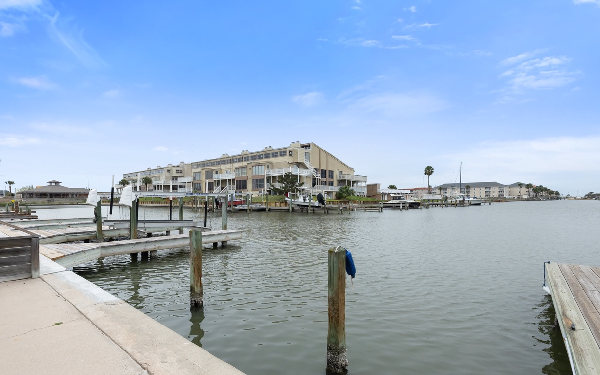 Waterfront property positioned along peaceful marina with private boat slip and scenic bay views.