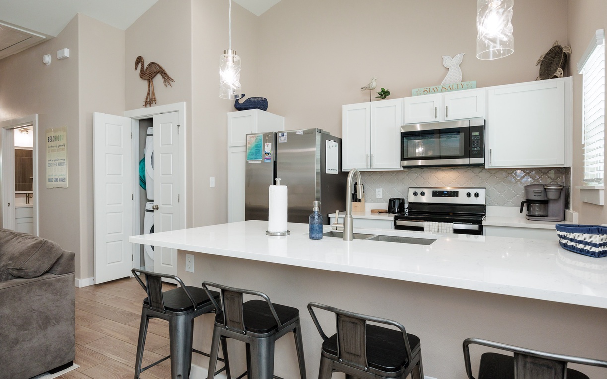 Your sleek kitchen island becomes the heart of your stay, perfect for morning coffee or casual meals with loved ones.