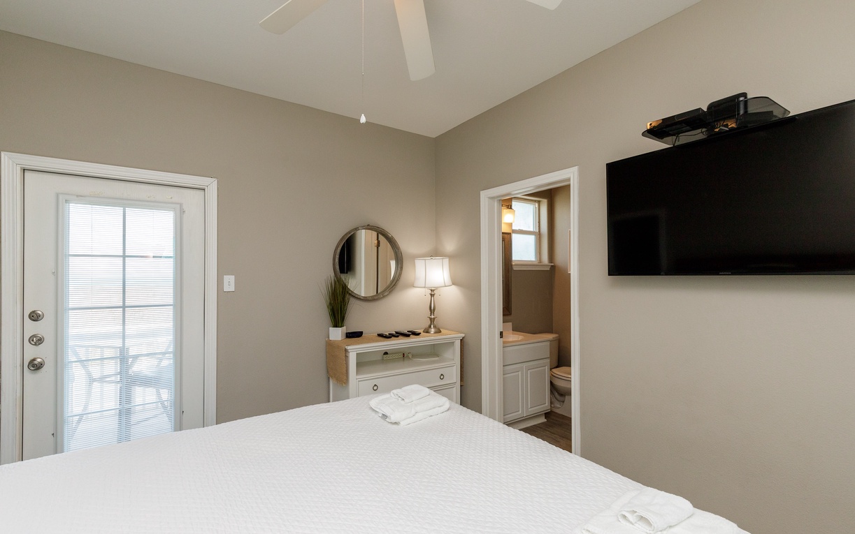 Unwind in your peaceful bedroom with vaulted ceilings, where crisp linens and modern amenities create the perfect retreat after exploring.