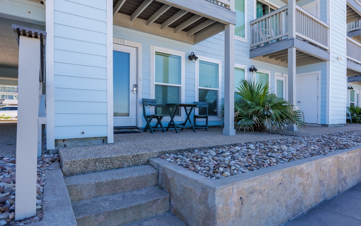 Coastal beach house with outdoor table perfect for morning coffee and evening relaxation.