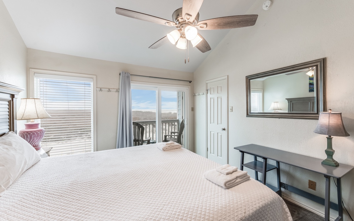 Wake up to mountain views through your private balcony doors, where fresh linens and thoughtful touches await your perfect getaway.
