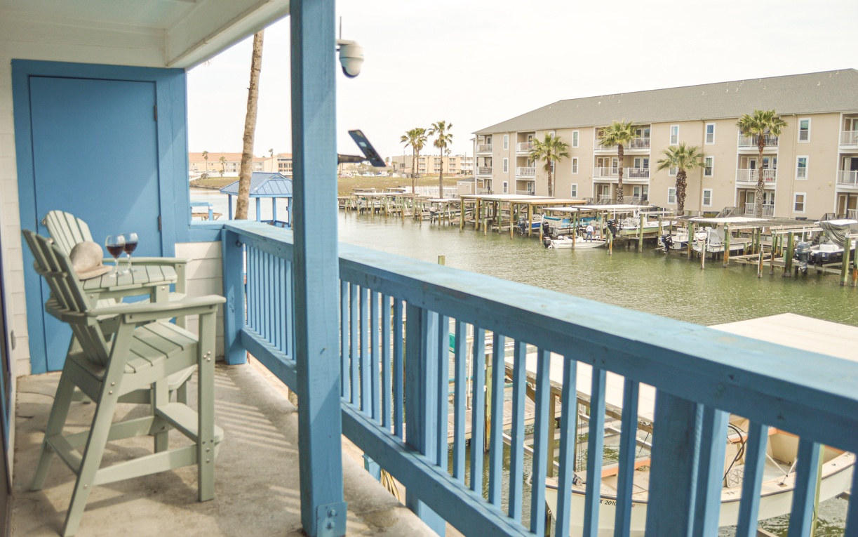 Sip your morning coffee on your private balcony while watching boats drift by the marina below.