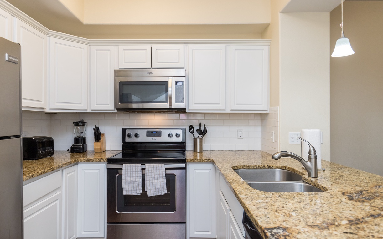 Your fully equipped kitchen awaits with granite counters, stainless appliances, and everything you need to create memorable meals during your stay.