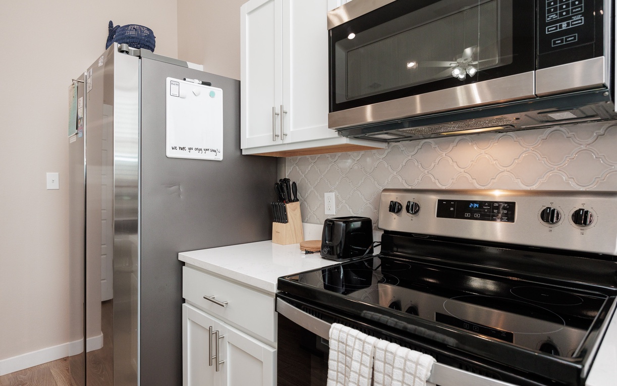Your fully equipped kitchen features stainless steel appliances and modern conveniences for preparing home-cooked meals during your stay.