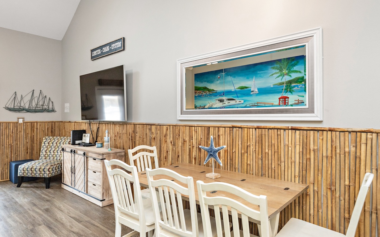 Your coastal-themed dining area features charming nautical touches and seats six comfortably for memorable meals together.
