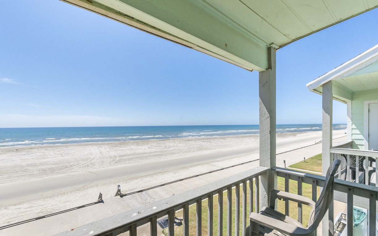 Beachfront balcony offers unobstructed ocean views with waves lapping pristine shores just steps from your door.